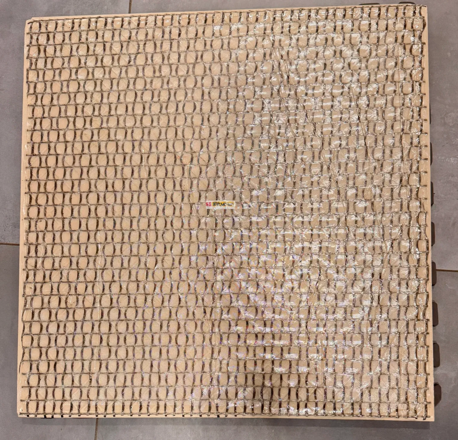 Factory applied, integrated safety backing for 2cm porcelain pavers; fall protection for porcelain pavers by skydeck usa.